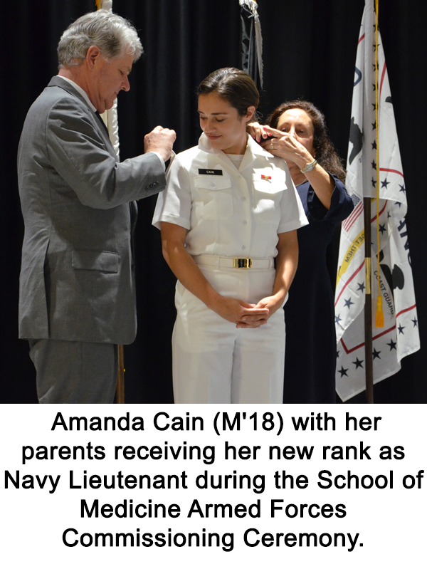  Amanda Cain (M'18) with her parents receiving her new rank as Navy Lieutenant during the School of Medicine Armed Forces Commissioning Ceremony.