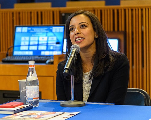 Christine Hanna speaks into a microphone