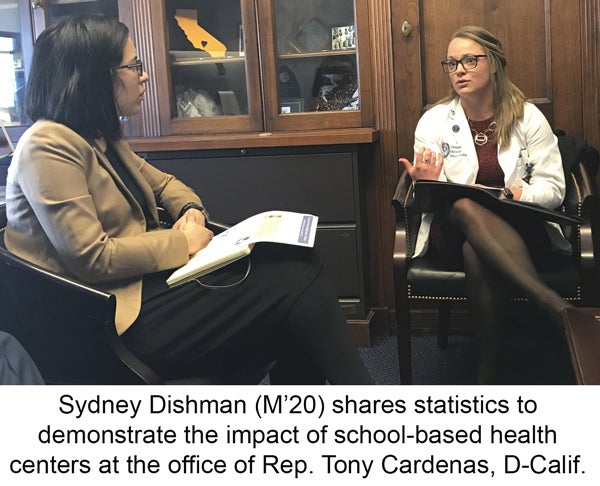 Sydney Dishman sits across from another woman at the office of Rep. Tony Cardenas