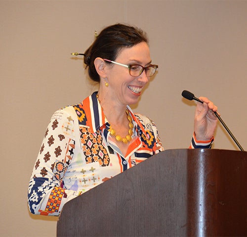 Melissa Haendel stands at a podium