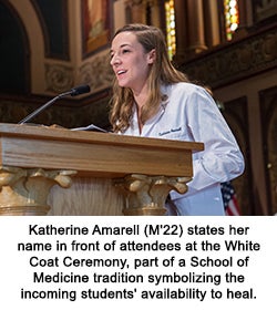 Katherine Amarell (M'22) states her name in front of attendees at the White Coat Ceremony, part of a School of Medicine tradition symbolizing the incoming students' availability to heal.