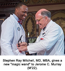 Stephen Ray Mitchell, MD, MBA, gives a new "magic wand" to Jerome C. Murray (M'22).