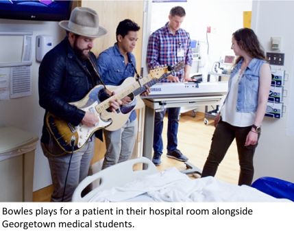 People playing music for a patient