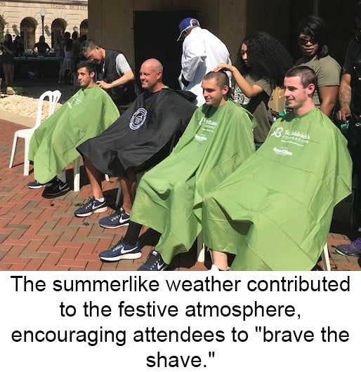 St. Baldrick's participants sit in plastic chairs draped in protective covers awaiting their shaves