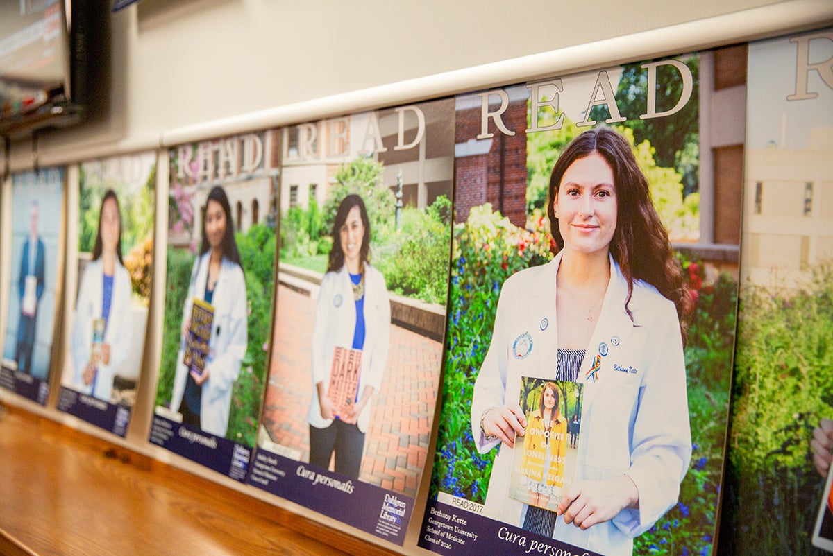 A series of READ Posters hangs along a wall