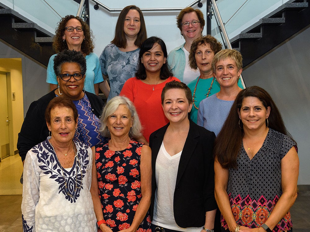 A group of women, all members of the GBCA, stand together