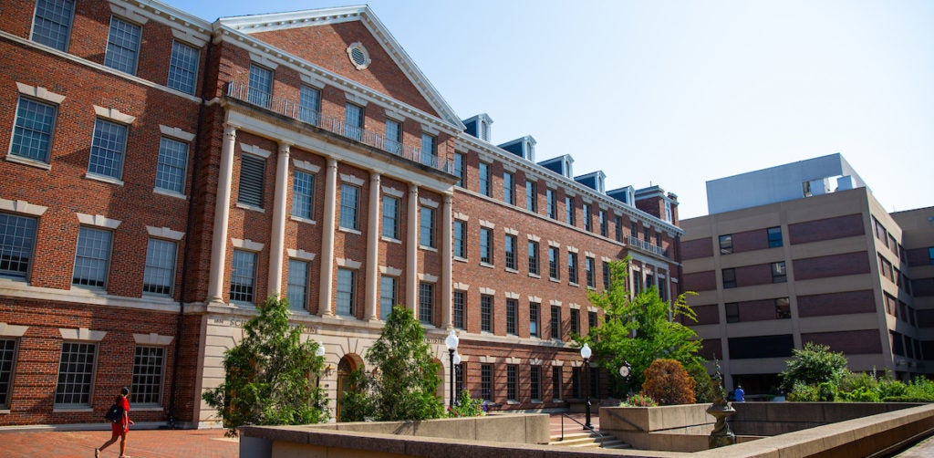 A view of the Med-Dent Building with other campus buildings in the background