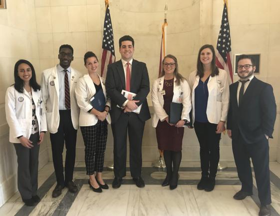 From left: Anjana Patel (M'20), Oswald Reid Jr. (M'20), Jessica Haladyna (M'20), Sydney Dishman (M'20), Jennifer Purks (M'21) and Matthew Angelo (L'20) stand with Eduardo (Ted) Sacasa, a legislative aide for Sen. Marco Rubio, R-Fla.