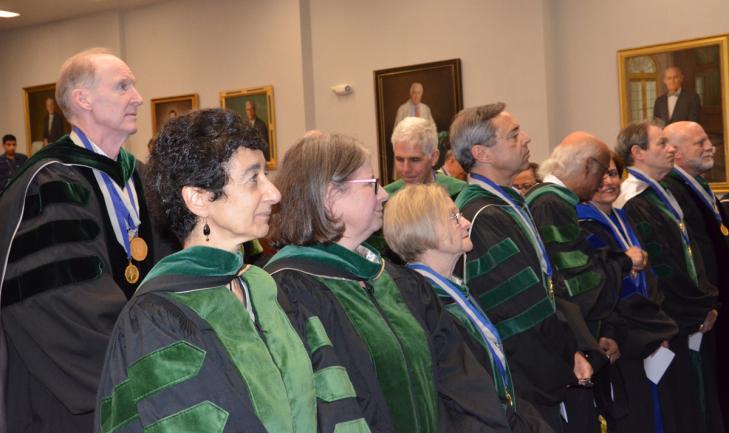 Members of the MAGIS Society of Master Teachers welcome two new inductees in a May 17 ceremony at the Gorman Auditorium at MedStar Georgetown University Hospital.