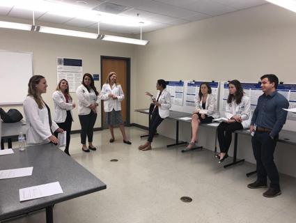 Medical students prepare to present their posters during Student Research Day 2018.