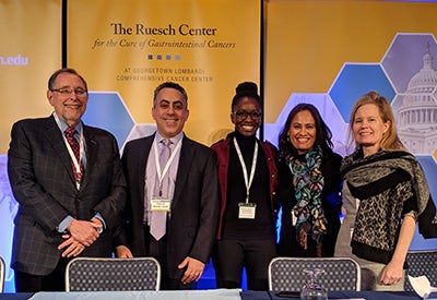 Panelists in a discussion on innovation and challenges in clinical research stand side by side for a group photo
