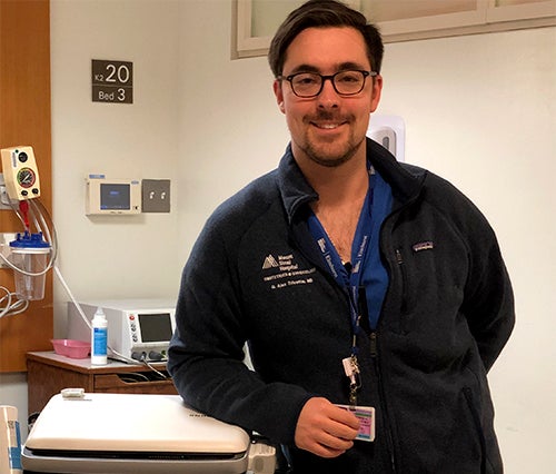 A man stands in a medical exam room