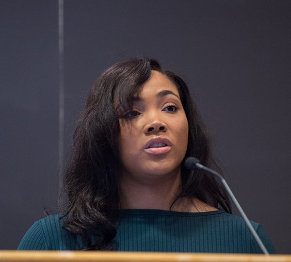 Courtney Reynolds speaks at a podium