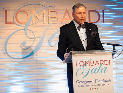 Dr. Louis Weiner speaks at a podium
