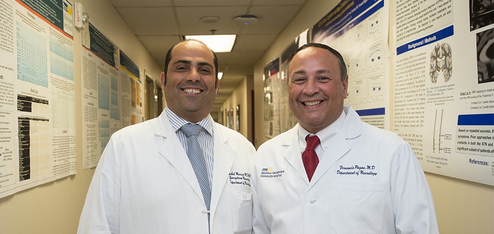 Doctors Moussa and Pagan stand in a hallway