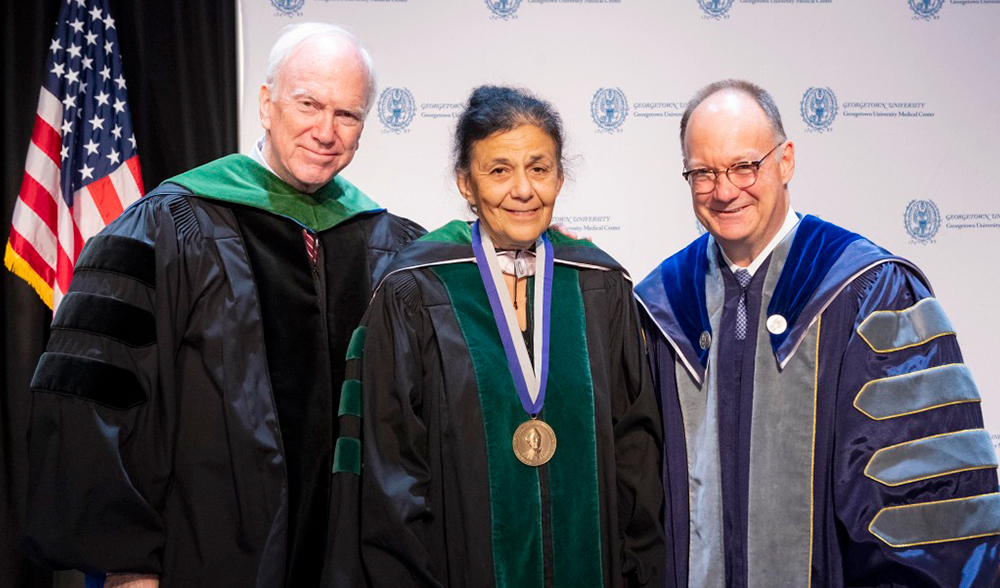 Dr. Healton, Dr. El-Sadr, and Dr. DeGioia stand side by side onstage