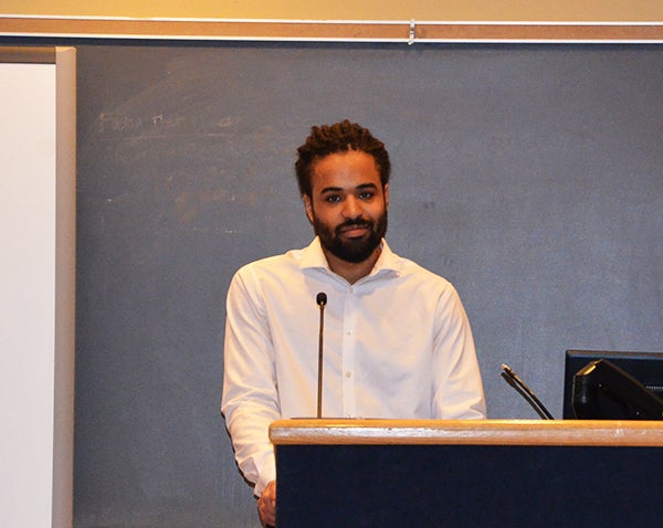 A man stands at a podium