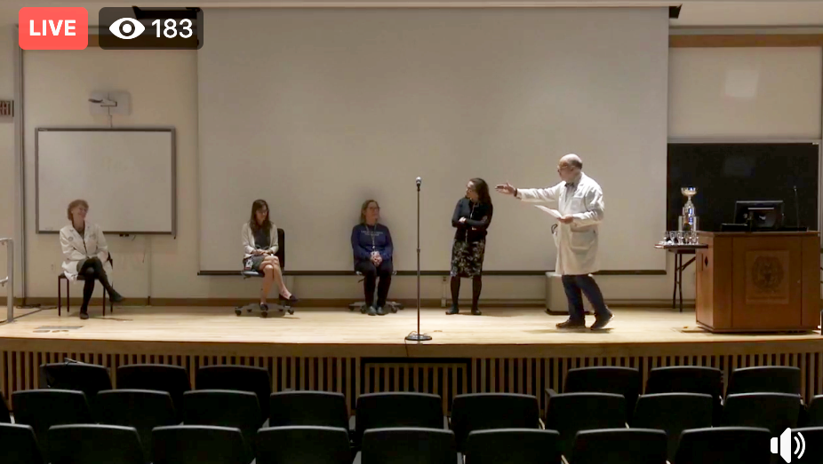 A Facebook Live screenshot of five people onstage during Match Day