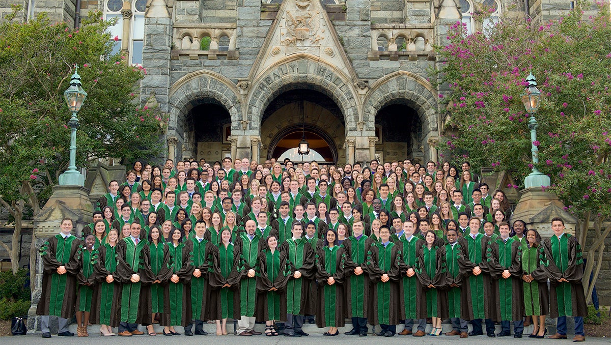 large group of medical graduates wearing academic regalia