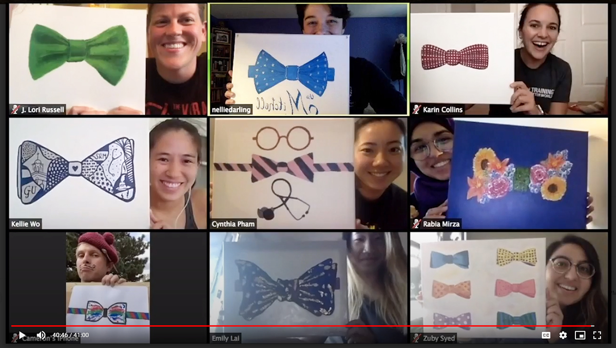 A screenshot of a Zoom call with students displaying bowtie artwork in honor of Dr. Mitchell