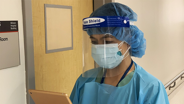 Christina Garza, MD, in full personal protective gear