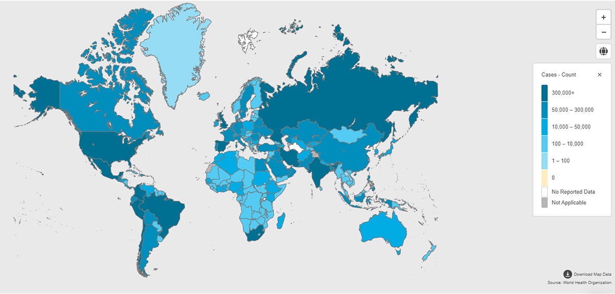 A map of the world shows the distribution of COVID-19 cases in different shades of blue