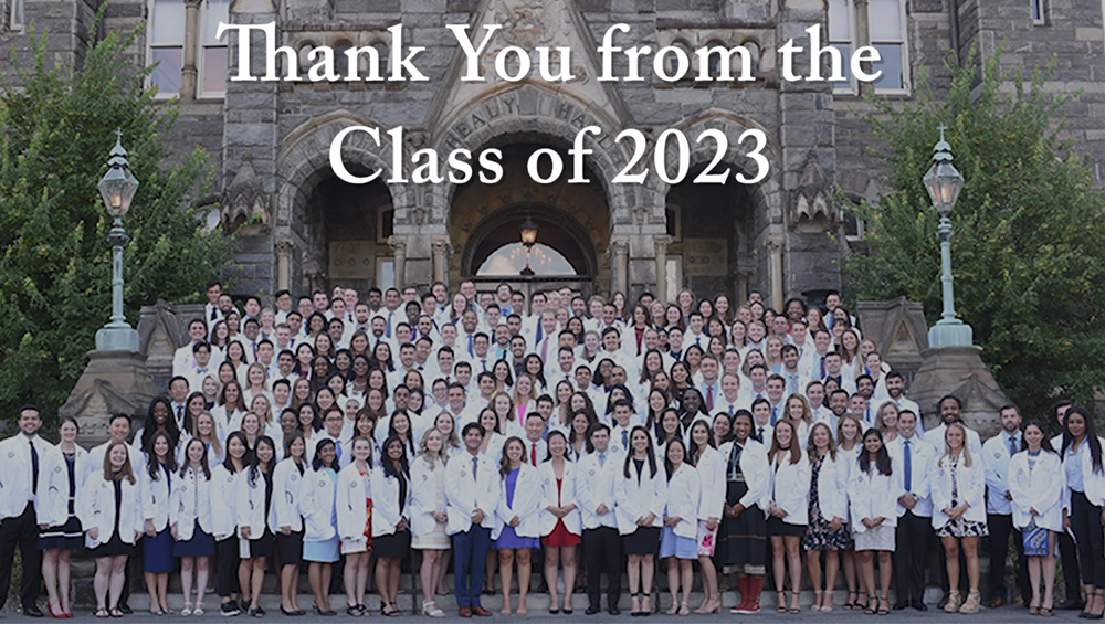 A photo of the School of Medicine class of 2023 pictured as a group at their White Coat Ceremony, with the words Thank You From the Class of 2023