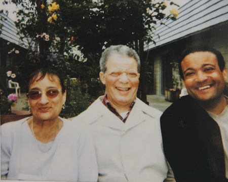 Jones' mother and father sit with him outdoors 