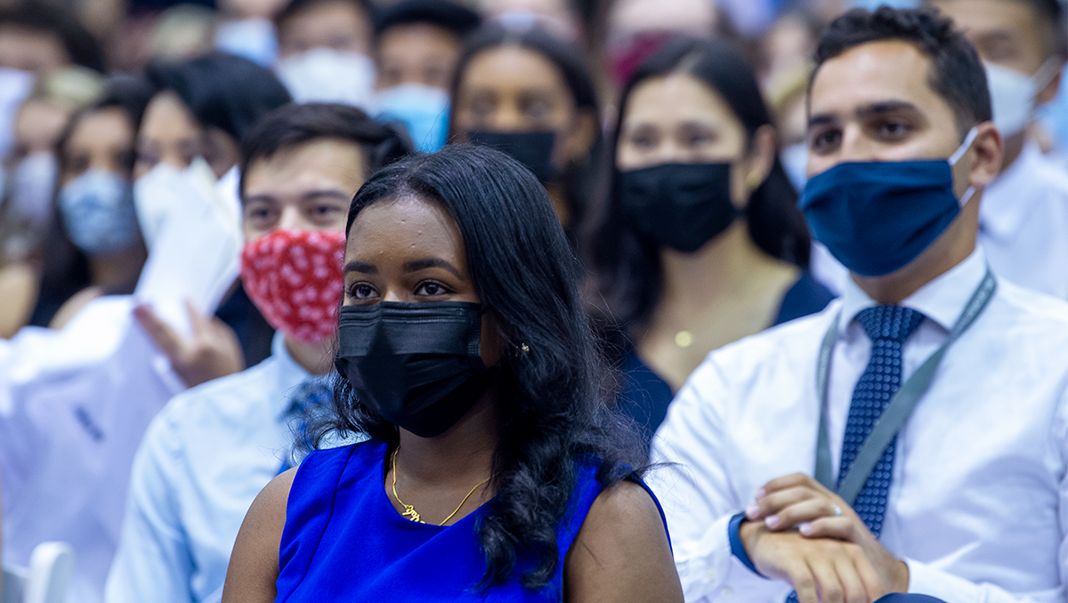 New School of Medicine students sit in a group during their White Coat ceremony