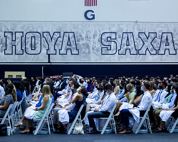 School of Medicine students sit in rows of chairs during the White Coat ceremony