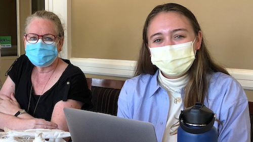 Dr. Ranit Mishori and Georgia Payne sit side by side at a table