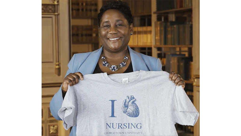 Roberta Waite holds an "I heart Nursing at Georgetown" t-shirt