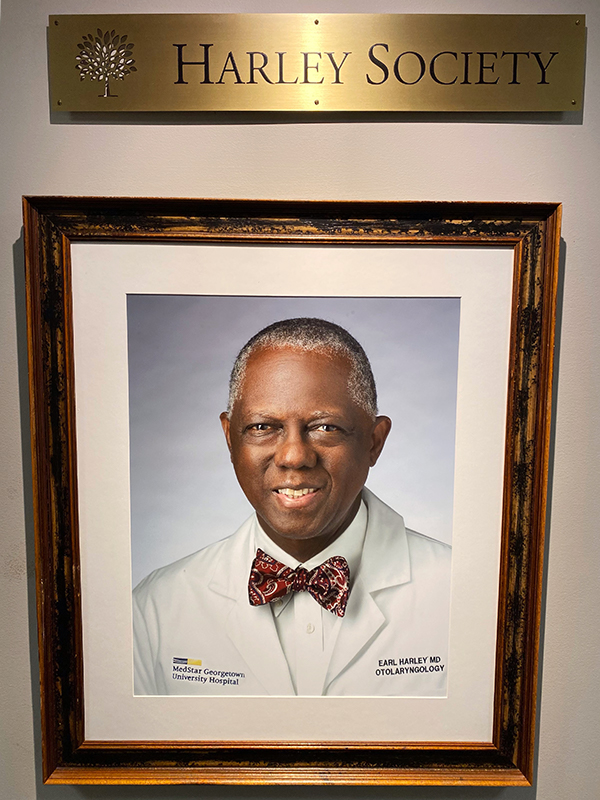 A plaque reads Harley Society above a framed portrait image of Dr. Harley