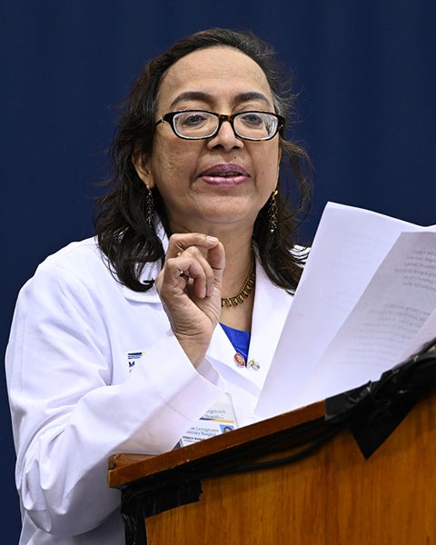 Princy Kumar speaks at a podium