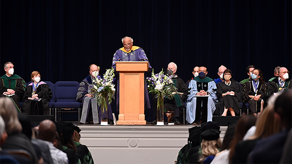 A long shot of the podium from which Dr. Goosby speaks, with other medical administration members seated behind it