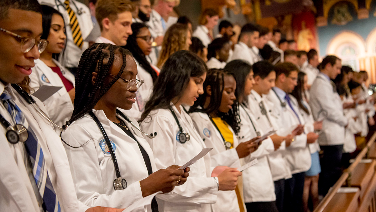 During this year's White Coat ceremony, medical students read aloud the Hippocratic Oath
