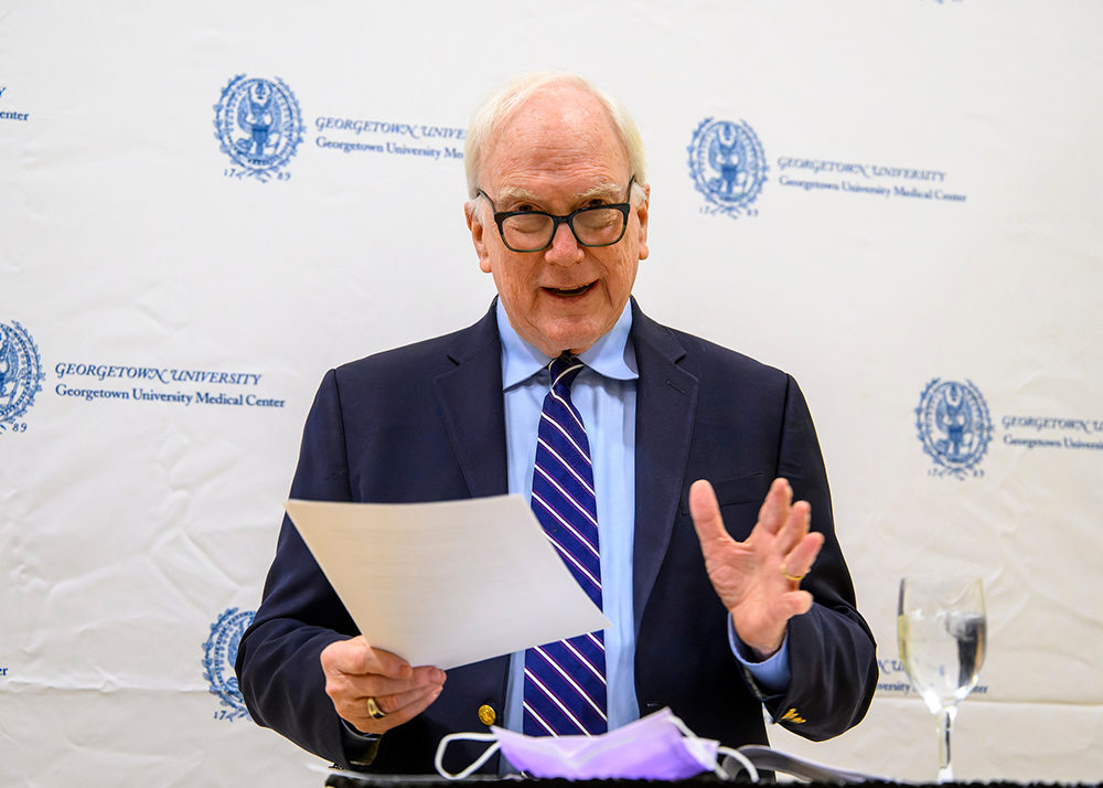 Dr. Healton speaks while holding a piece of paper