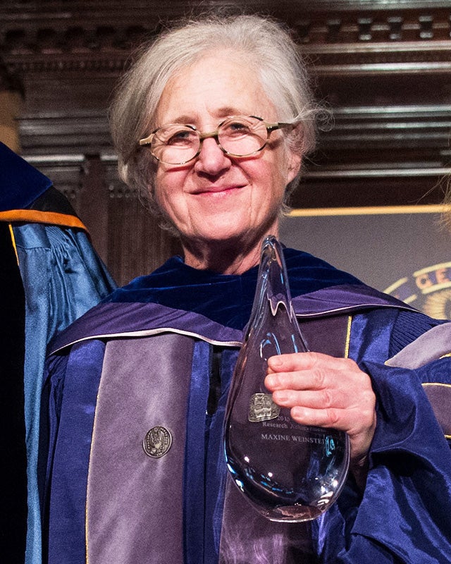 Maxine Weinstein holds a glass award