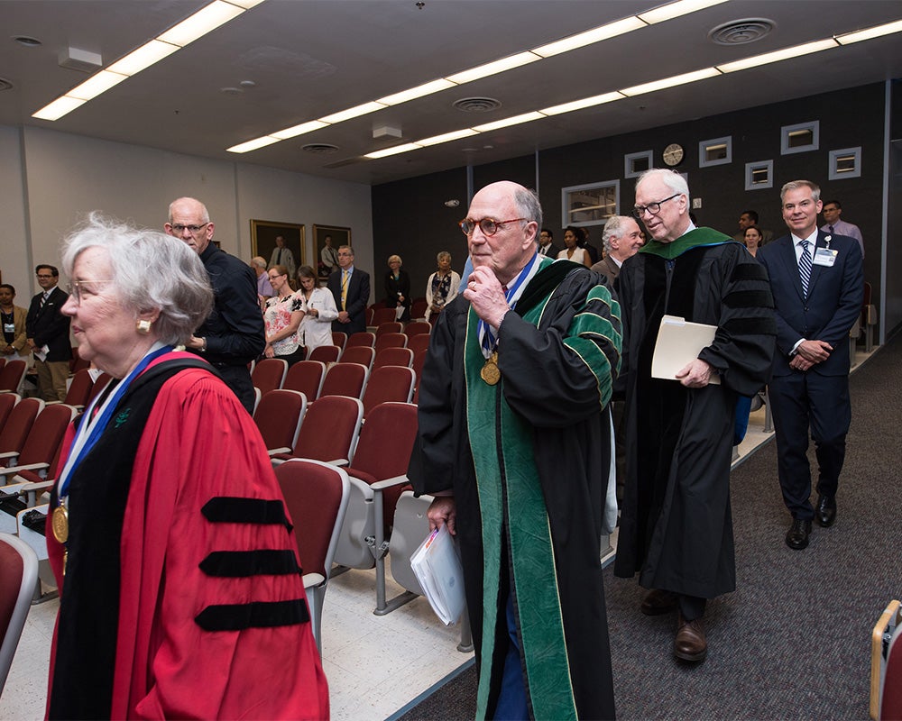 Faculty process into the MAGIS ceremony