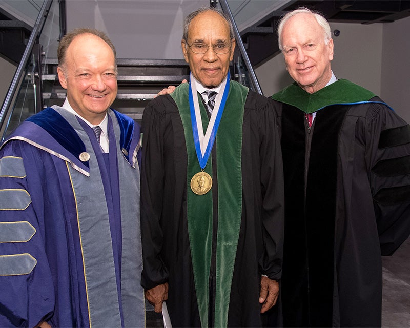 President DeGioia, Dr. Freeman and Dr. Healton stand together