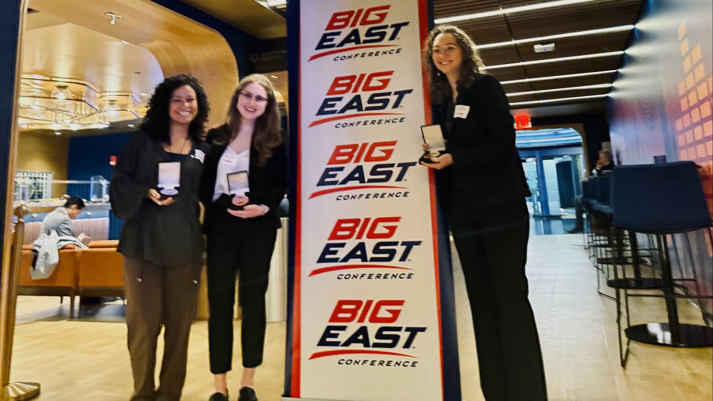 Sophia Rose Monsalvo (CAS'26), Claire Auslander (N'26) and Evan Bianchi (CAS'25) at the 2025 BIG EAST Undergraduate Research Poster Symposium