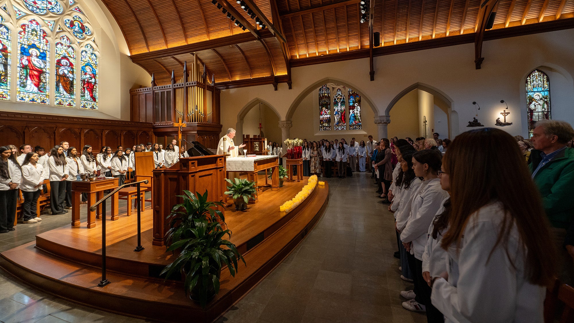 Father Shea leads the Donor Mass for worshippers including medical students and the families of the anatomical donors