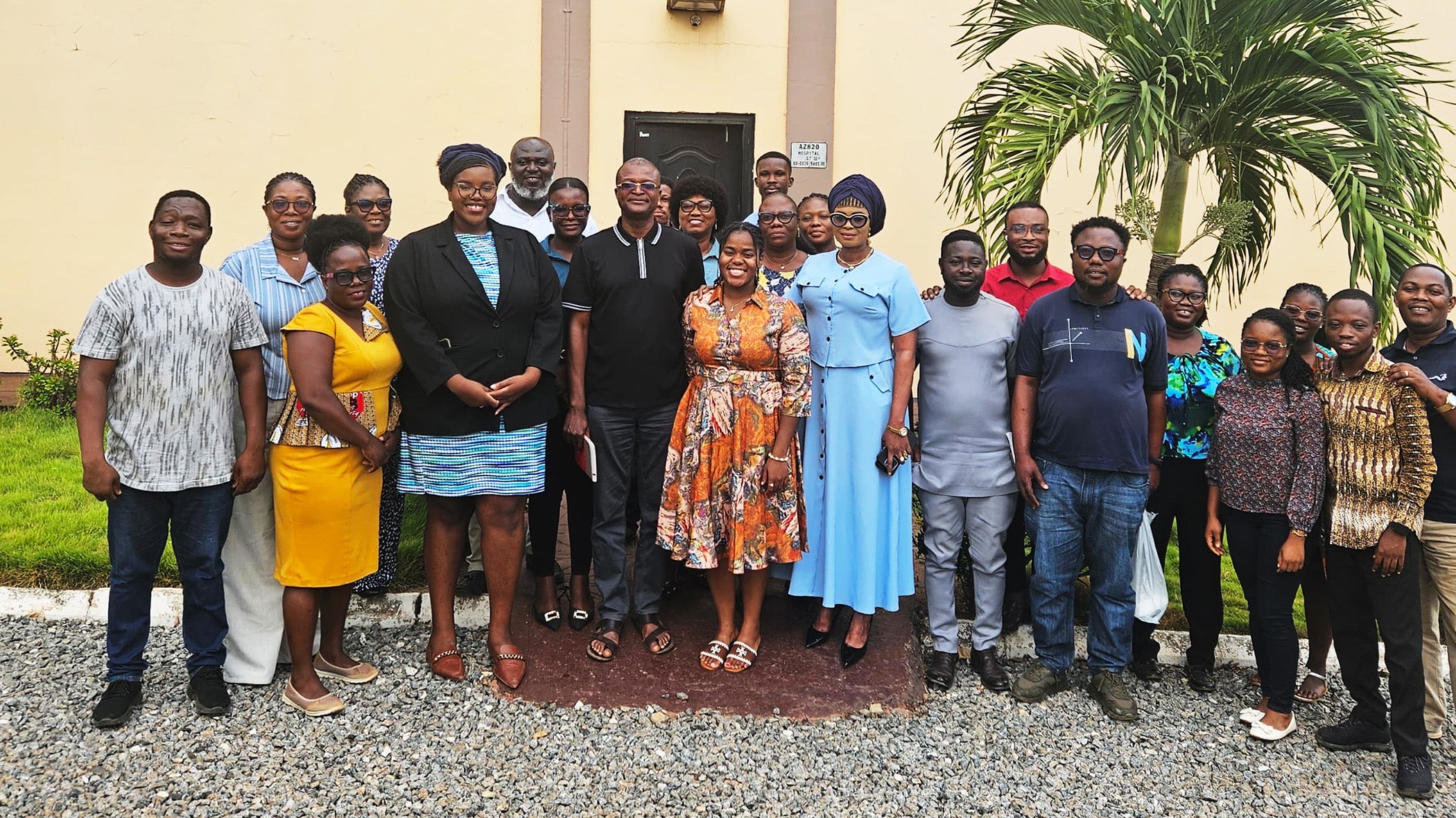 Student Tara-Yesomi Wenegieme stands with a group of hospital workers in Ghana