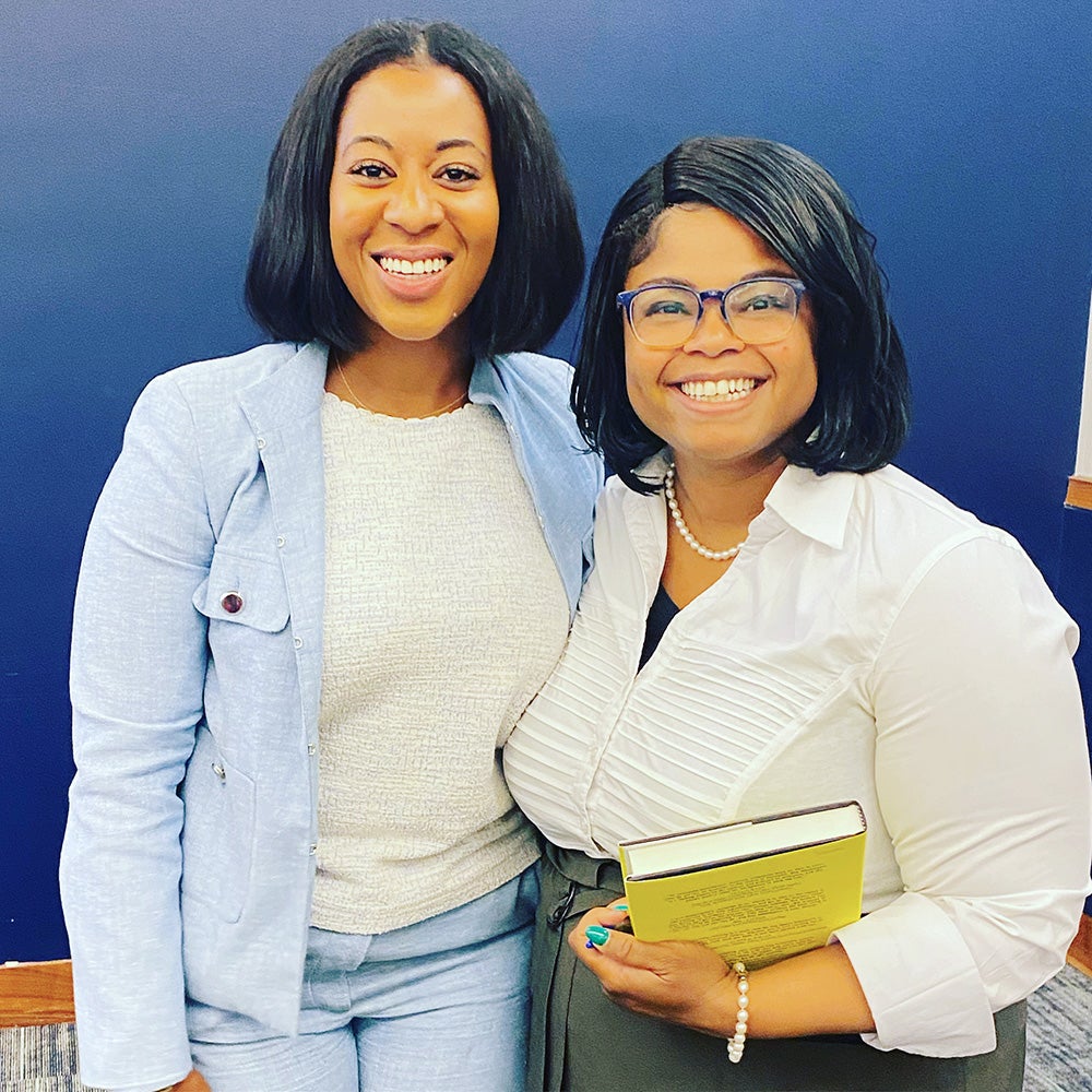Two women stand together
