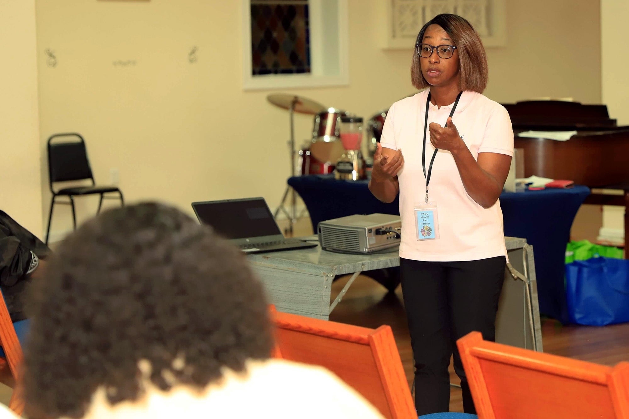 Georgetown's Mirelle Bright speaks in a church to participants in an education session
